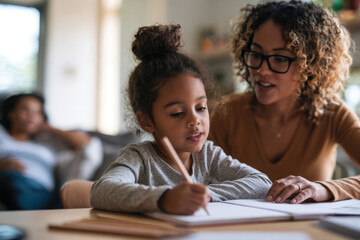 Obraz premium A young girl joyfully engages in her learning while her mother assists her, emphasizing the supportive relationship and encouragement in early childhood education.