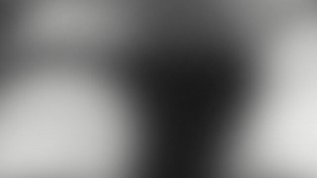 Abstract smooth gradient background with dark grey tones and soft light grain