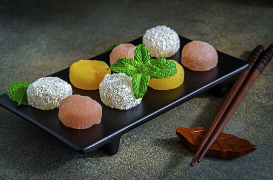 Assortment of colorful mochi traditional japanese dessert on tray