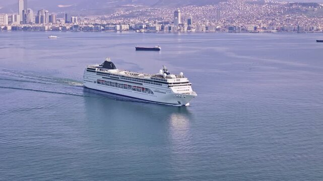 Large passenger vessel moving across sea water. Drone footage of cruise ship used for maritime travel and tourism