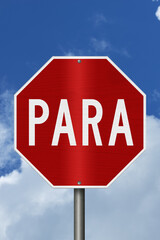 Red stop Para Spanish sign with sky © Karen Roach