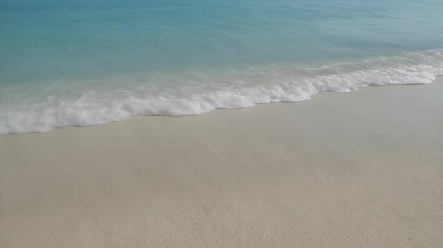 Nature - Gentle ocean wave washing onto a clean white sandy tropical beach shore