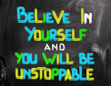 Inspirational quote believe in yourself and you will be unstoppable written on a black chalkboard