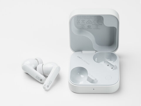 Dnepr, UKRAINE 09.16.2026 : CMF by Nothing Buds Pro 2 wireless earbuds in white. Charging case and pair of CMF. Full depth of field	