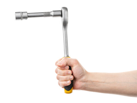 Male hand holding metal socket ratchet wrench tool with extension bar isolated on white background.