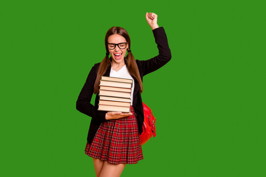 Portrait tails thrilled lady teenager eyewear eyeglasses aims good marks courses raise fist scream yeah close eyes red checked plaid pullover sweater skirt black jacket isolated yellow background