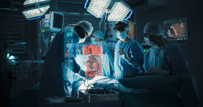 Futuristic Hospital Operating Room Surgery Using Holographic Augmented Reality. Surgical Team in an Ar Headset Views a Floating Intestine Hologram and Vital Signs While Treating the Patient's Bowel.