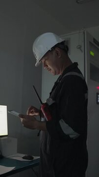 Footage engineer using computer check analysis continuous emissions monitoring system for air pollution reduction. Sustainable environment technology data information Concept energy saving, control