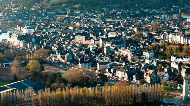 Drone view of Honfleur travel destination in Normandy, with coastal town layout, harbor water and historic French urban scenery