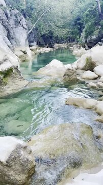 Vertical video of a breathtaking mystical canyon in Akseki featuring stunning turquoise freezing cold river water and majestic natural scenery