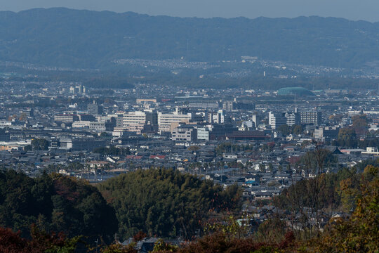 Panorama view of Kashihara city landscape with mountain range background under clear autumn sky in Nara Japan