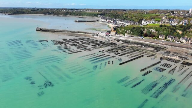 Drone view of intertidal oyster beds in Cancale, Brittany, low tide reveals the full extent of shellfish farming plots