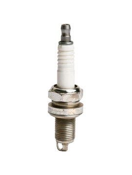 A detailed close up of a metal and ceramic ignition component used in internal combustion engines for vehicle service and mechanical engineering