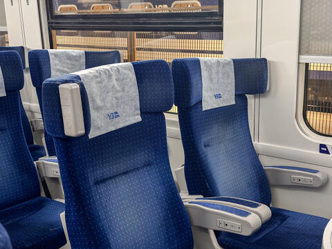 Przemysl, Poland - March 8, 2026: Ukrainian Railways train seats in a clean passenger carriage with blue upholstery, representing modern intercity travel and public transport
