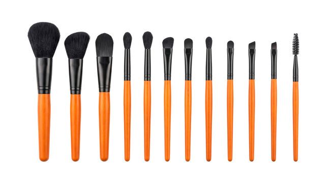 Halloween makeup brush set with orange handles and black bristles for costume makeup beauty applications face painting and seasonal styling isolated on transparent background