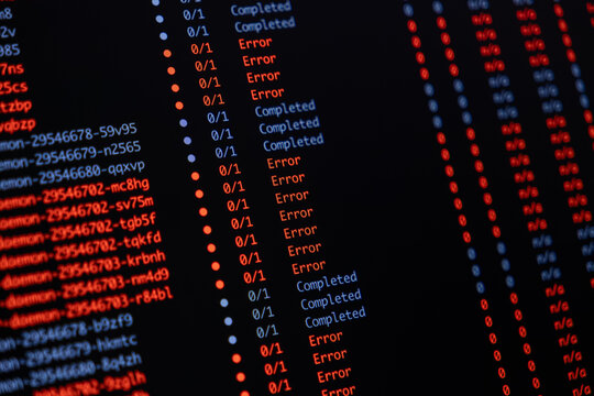 Programming code showing a list of task statuses with many red error messages and blue completed marks on a dark screen representing software debugging or system failure