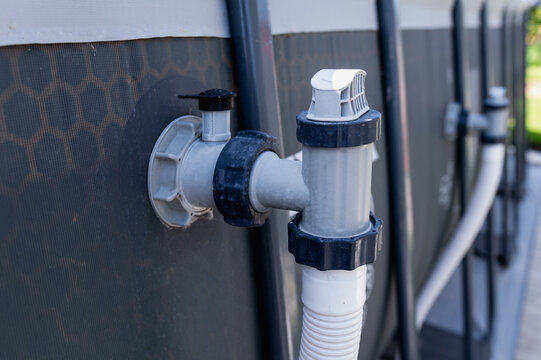 Connection valve or fitting for a frame pool filtration system, to which the hose connects closeup