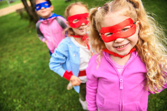 Group kids friends Superhero playing togetherness and having fun outdoor