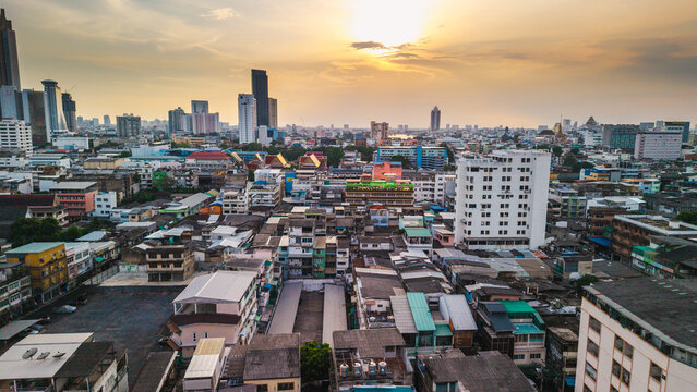 Bangkok Skyline at Sunset Above Dense Urban Rooftops