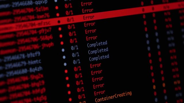 Programming code displays server deployment errors on a dark monitor, illustrating critical software system failure, infrastructure monitoring and debugging in digital workspace. Zoom