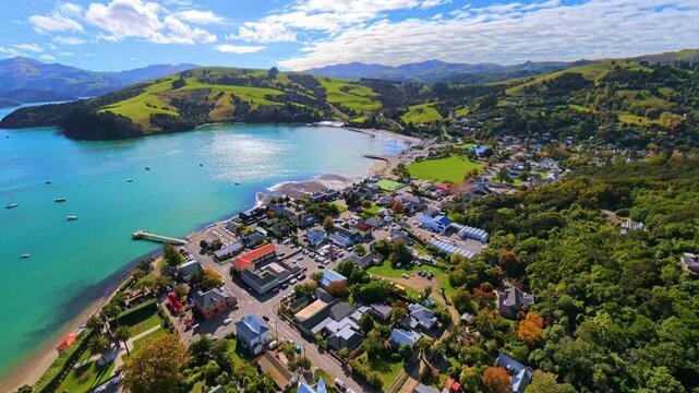 Aerial view of New Zealand, green hills and coastal town, Akaroa