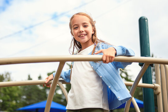 Little girl on on a playground having fun