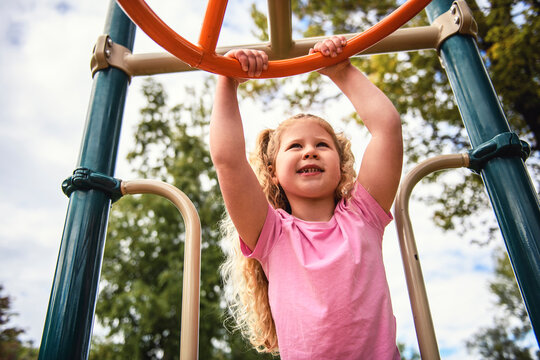 Little girl on on a playground having fun