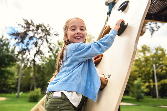 Little girl on on a playground having fun