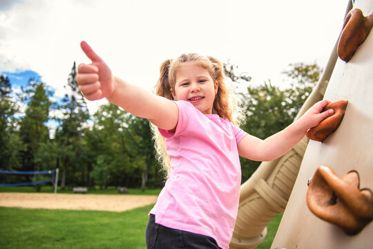 Little girl on on a playground having fun