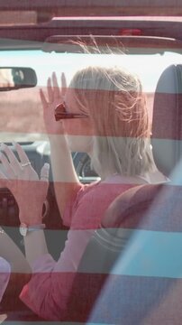 Cruising Diverse female friends in convertible car on sunny road, with sunglasses, copy space