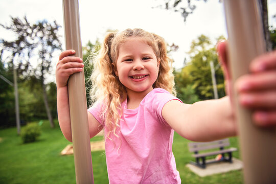 Little girl on on a playground having fun