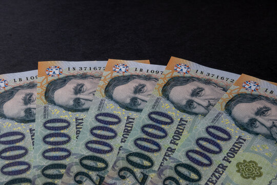 Hungarian 20000 forint banknotes arranged on black background