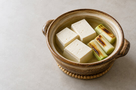 Japanese yudofu tofu hot pot with grilled negi onion