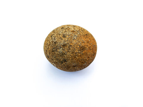 Single round natural river stone with rough texture isolated on plain white background. Geology material mockup with space for text and design layout.
