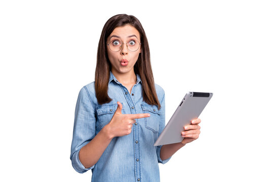 Photo of impressed sweet long hairdo girl pointing tablet wear spectacles blue cloth isolated on grey background