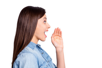 Close up profile portrait of pretty funky brunette hairdo girl yelling hand wear blue cloth isolated on grey background © deagreez