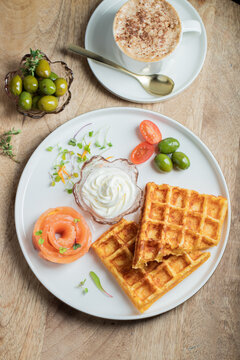 Crunchy waffle fries with sour cream dip served in a basket