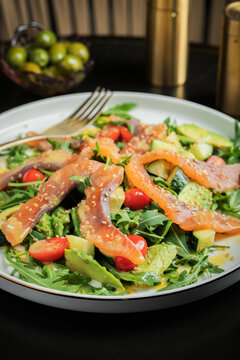Salad with salted salmon and arugula