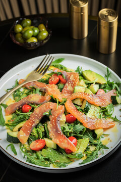 Salad with salted salmon and arugula
