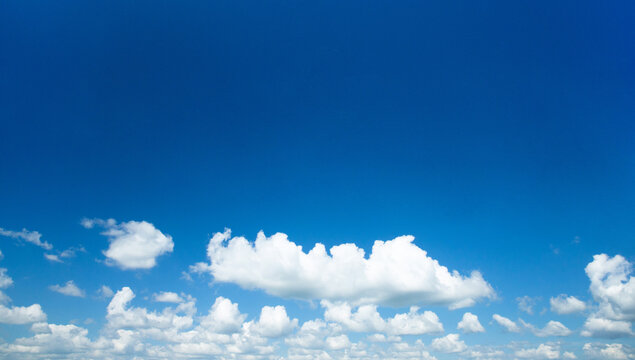blue sky background with tiny clouds