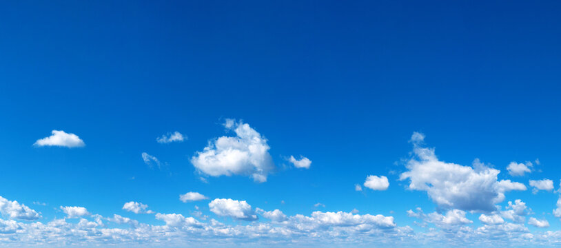 Blue Sky background with tiny Clouds. Panorama background