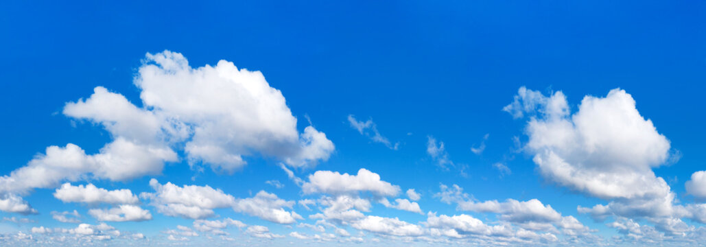 Panoramic fluffy cloud in the blue sky. Sky with cloud on a sunny day.