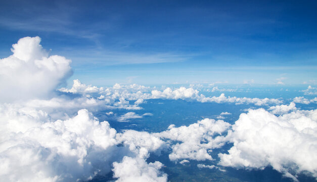 blue sky with clouds and sun