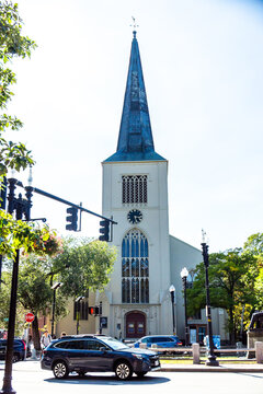 Church steeple rises above busy Boston street near historic cathedral