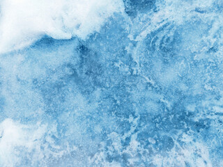 Blue ice texture with snow and frozen patterns and cracks © Ольга Подлесная