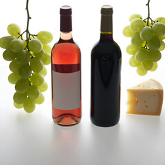 Obraz premium Wine tasting and gourmet food pairing, rose and red wine bottles with fresh green grapes and cheese wedge for luxury dining and hospitality marketing