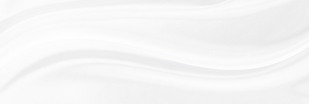 White gray satin texture that is white silver fabric silk panorama background with beautiful soft blur pattern natural.