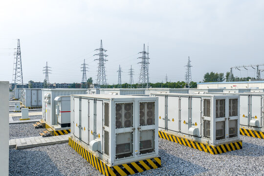 Industrial power substation equipment under high voltage transmission towers