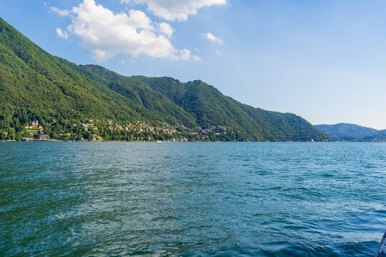 Nature Lake Como Italy Lago di Como Alps Mountains. Green picturesque Hills town Bellagio and Varenna. Italian travel. Blue summer sky.