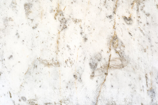 White marble background with grey and gold veining